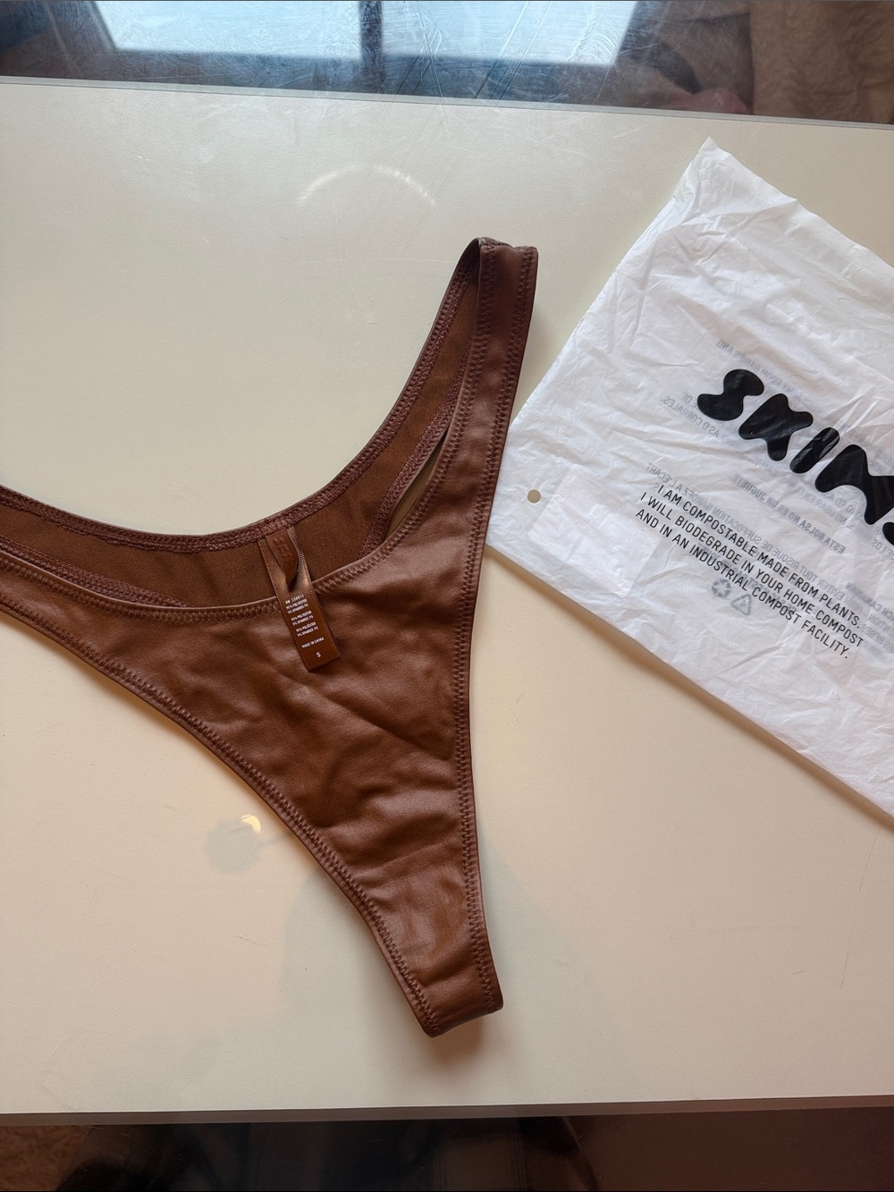 Skims Leather Butterfly Thong